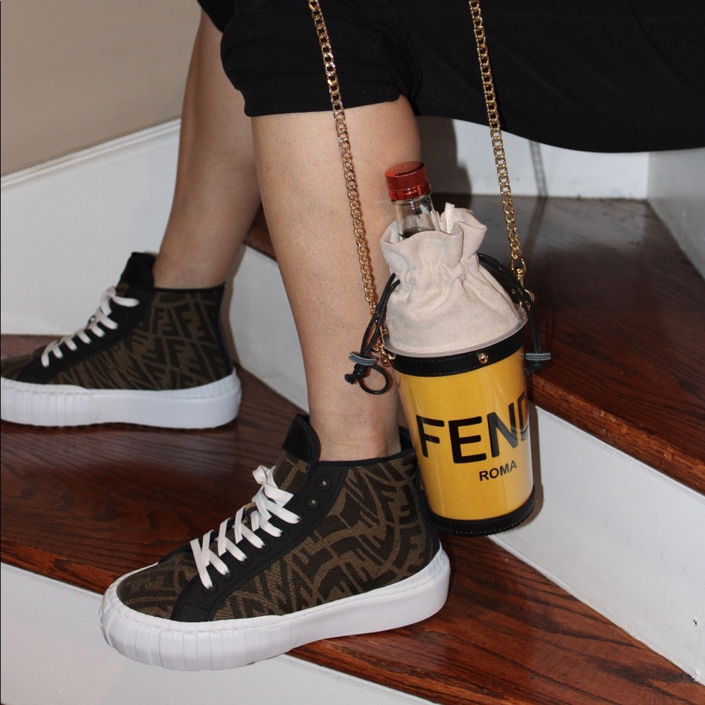 Designer shopping bag upcycled into a crossbody bag